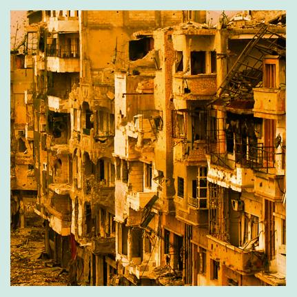 A street lined with damaged buildings in Syria