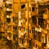 A street lined with damaged buildings in Syria